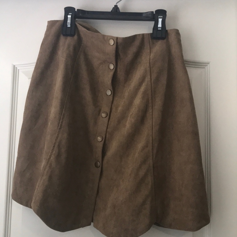 Selling a brown button down circle skirt.